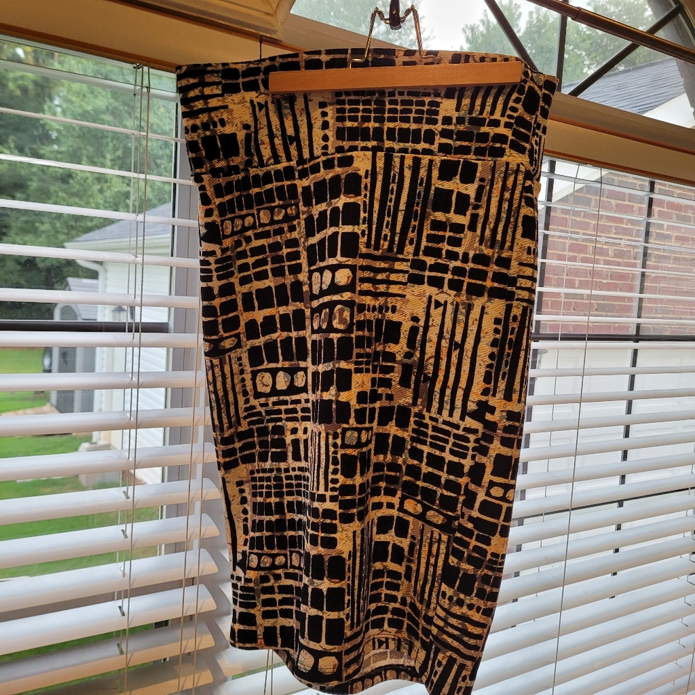 LuLaRoe black skirt with fun pattern.